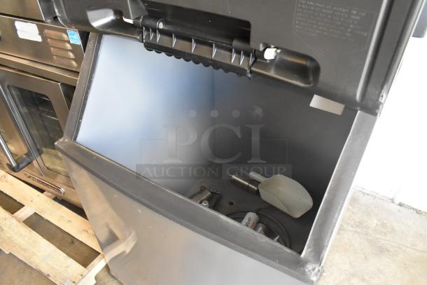 Scotsman CME506AS-32F stainless steel ice head on Hoshizaki B570 bin, 208/230V, 1 Phase, commercial use, open bin view.