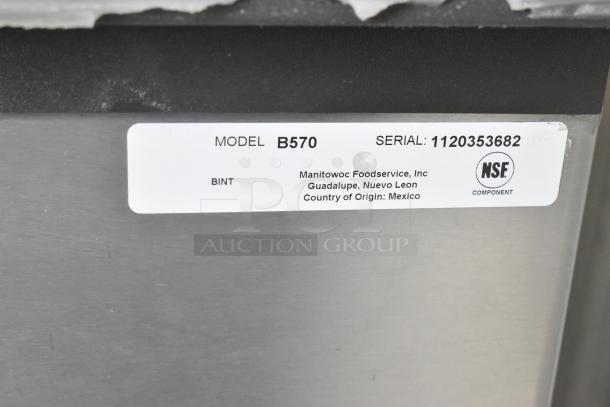 Stainless steel Scotsman CME506AS-32F ice head on Hoshizaki B570 bin, label shows model B570, serial 1120353682, NSF certified.