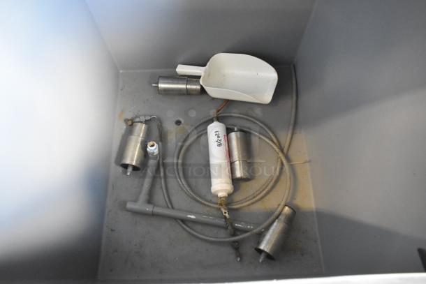 Stainless steel components and a plastic scoop inside a Scotsman CME506AS-32F ice head on Hoshizaki B570 bin, 208/230V.