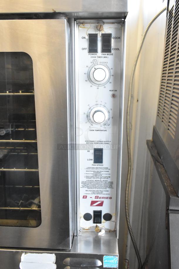 Southbend B Series stainless steel convection oven with view-through doors, metal racks, and thermostatic controls. Visible control panel.