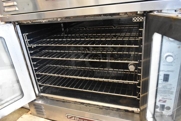 Two Southbend B Series stainless steel convection ovens with view-through doors, metal racks, thermostatic controls. 