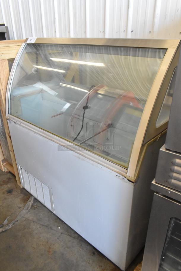 Metal commercial ice cream dipping cabinet, 115 volts, 1 phase, clear curved glass top, minor wear, suitable for display.