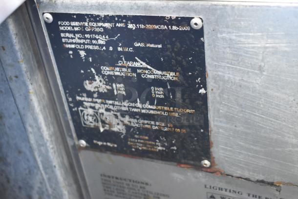 Globe GFF35G stainless steel floor-style natural gas deep fryer, 90,000 BTU, includes 2 fry baskets. Visible wear on label.