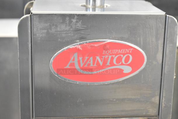 Avantco stainless steel commercial countertop sausage stuffer with red branding. Visible wear, good condition.