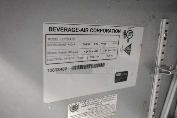 Beverage Air UCF27A-23 stainless steel undercounter freezer label showing model, refrigerant, voltage, and design pressure.