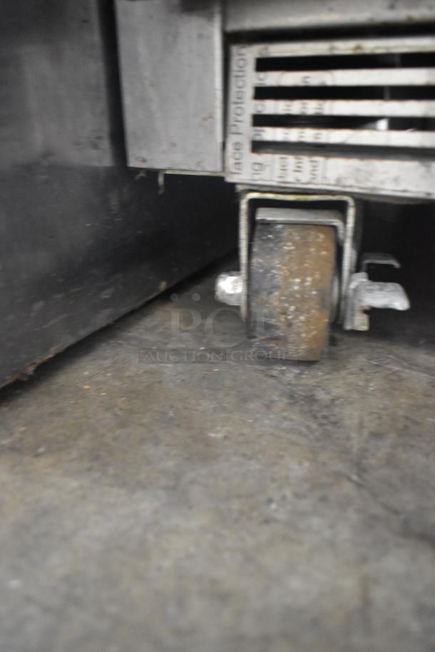 Beverage Air UCF27A-23 undercounter freezer caster, showing rust and wear. Stainless steel, commercial grade. 115V, 1 phase.