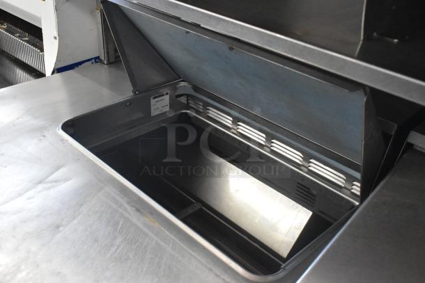 Delfield stainless steel commercial sandwich salad prep table, open top view, with over shelf, 4 drawers, used condition.