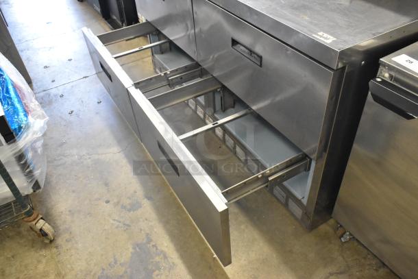 Delfield stainless steel sandwich salad prep table with four drawers, 115V, 1 phase, with over shelf; good condition.
