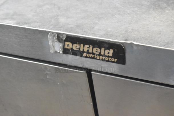 Delfield Stainless Steel Commercial Prep Table, 4 Drawers, Over Shelf, visible wear, Delfield label intact. 115V, 1 Phase.
