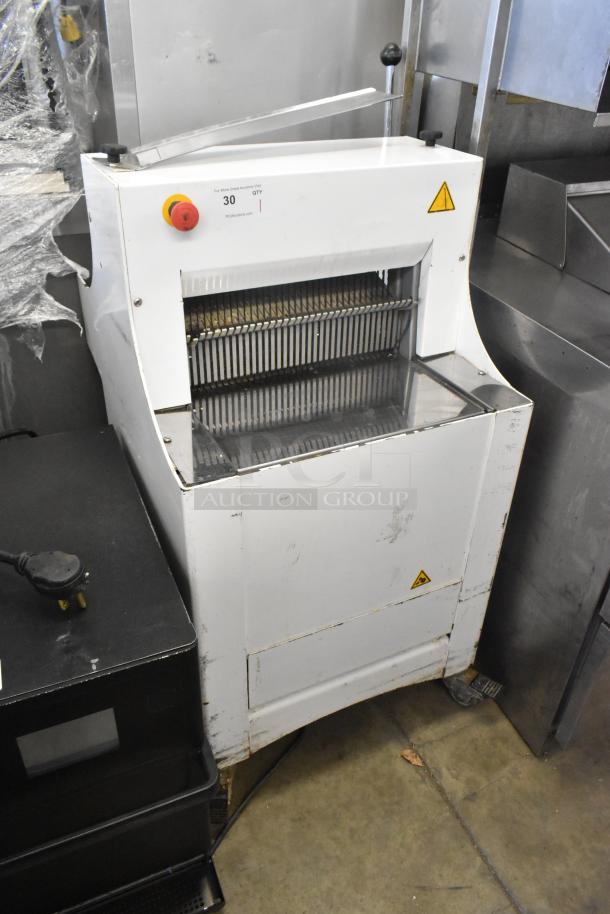 2018 Doyon CPF412 bread loaf slicer on casters, 115V, 1 phase; white metal body, visible wear, commercial setting.