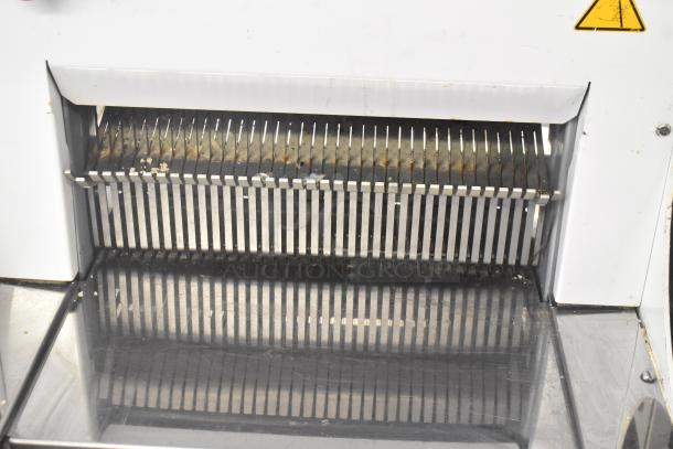 2018 Doyon CPF412 bread loaf slicer, metal, commercial floor style, on casters, 115V, 1 phase. Visible wear on slicer blades.