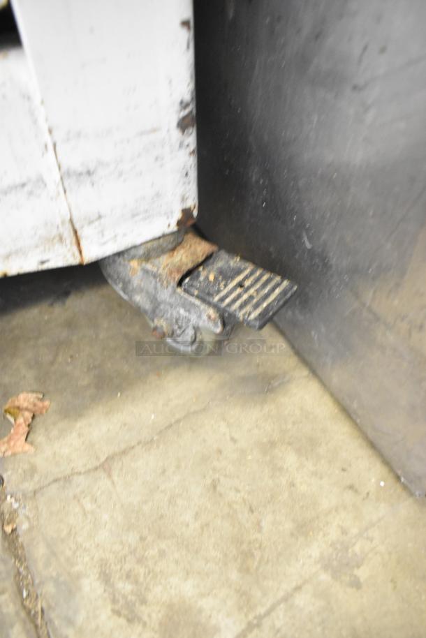 2018 Doyon CPF412 bread loaf slicer on casters, metal construction, 115V, 1 phase, commercial use, visible wear.