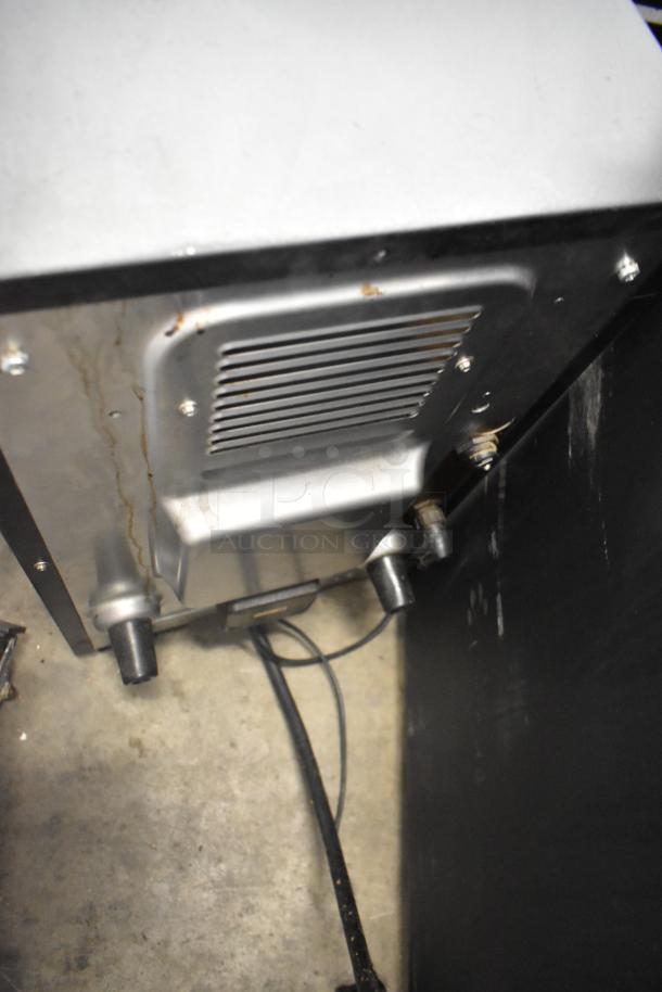 Turbochef commercial countertop rapid cook oven, metal, 208/240V, 1 phase, electric powered, visible wear, underside view.