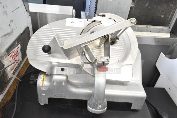 Berkel metal commercial countertop meat slicer, 115 volts, 1 phase. Clean, robust build, with visible control knob and warning label.