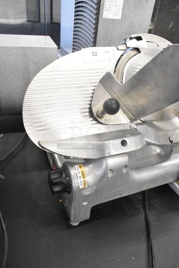 Berkel metal countertop meat slicer, 115 volts, 1 phase. Features adjustable thickness knob and safety warnings.