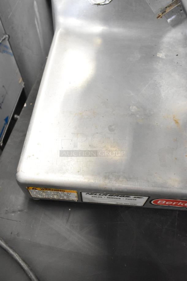 Berkel metal commercial countertop meat slicer, 115 volts, 1 phase, visible warning and brand labels, used condition.