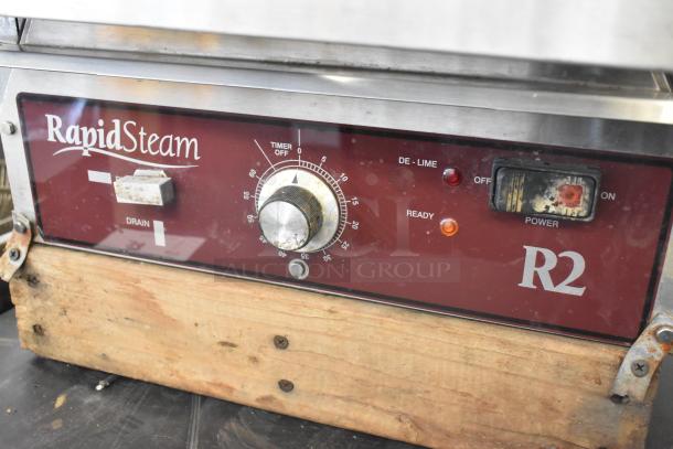 Southbend R2 stainless steel steam cabinet control panel, showing timer knob, power switch, and RapidSteam branding.