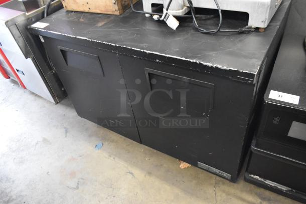 2018 True TUC-48-LP-HC undercounter cooler, 2 doors, commercial use, visible wear on black metal, 115V, 1-phase.