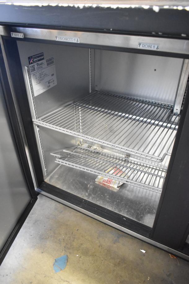 2018 True TUC-48-LP-HC commercial 2-door undercounter cooler, metal finish, 115 volts, 1 phase, visible wear inside.