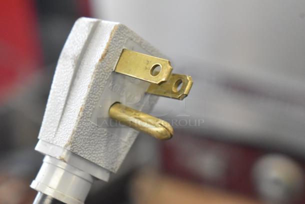 Close-up of a three-prong electrical plug for a 2018 True TUC-48-LP-HC undercounter cooler. Plug shows slight wear.