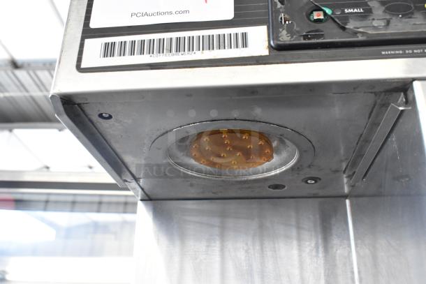 Curtis TP2T10A3159 stainless steel commercial double coffee machine, 220V, showing underside heating element and control panel.