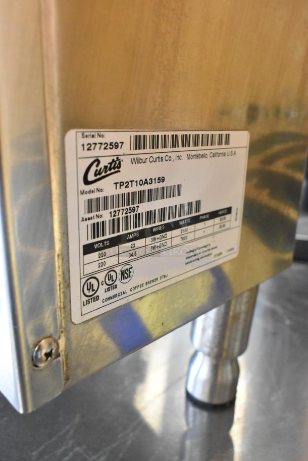 Curtis TP2T10A3159 stainless steel commercial double coffee machine, 220V, 1-phase, model label with UL and NSF marks.