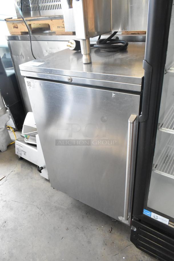 Perlick BN24 stainless steel undercounter cabinet, single door, missing one leg, some surface wear visible.