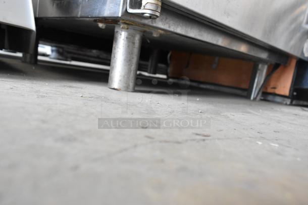 Perlick BN24 stainless steel under-counter cabinet, single door, missing one leg, model BN24.