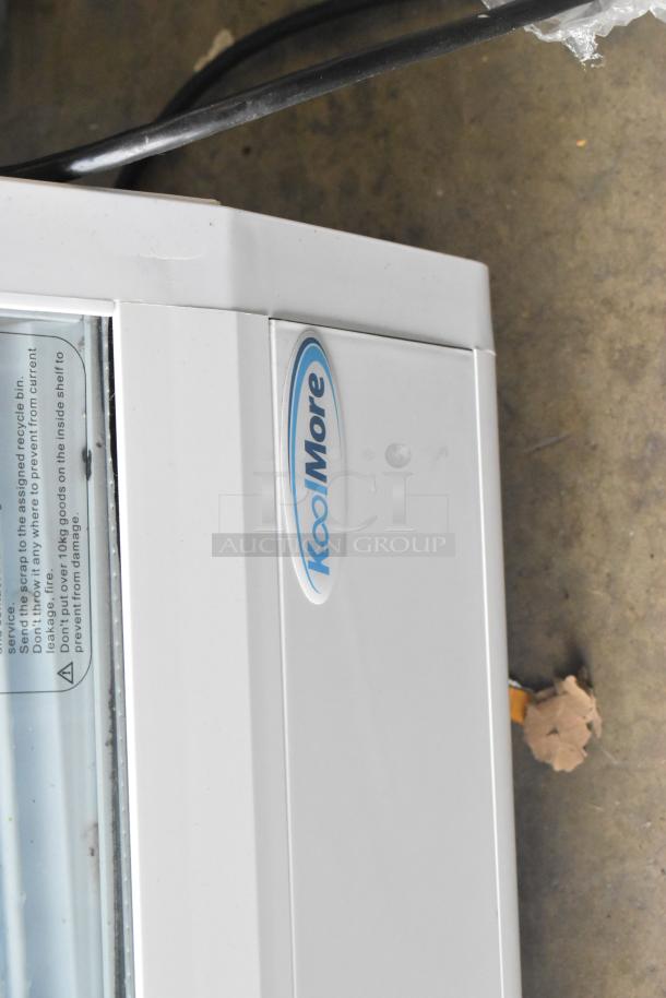 Brand new KoolMore CDC-3C-WH countertop display refrigerator, 3.6 Cu Ft, with brand logo visible, minor scratches.