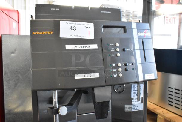 Schaerer Ambiente metal commercial espresso machine, 210V, 1 phase, control panel with labeled buttons, signs of use.