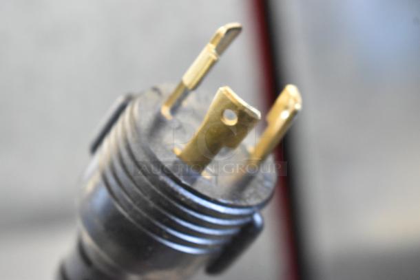 Close-up of a power plug for a Schaerer Ambiente Metal Commercial Espresso Machine, 210 Volts, 1 Phase.