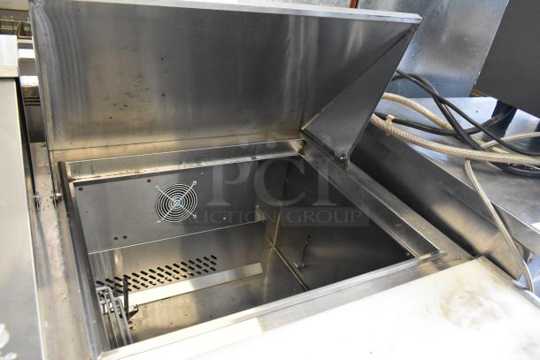 2019 Bison BST-72-30 stainless steel commercial sandwich salad prep table shown open, with internal fan visible.