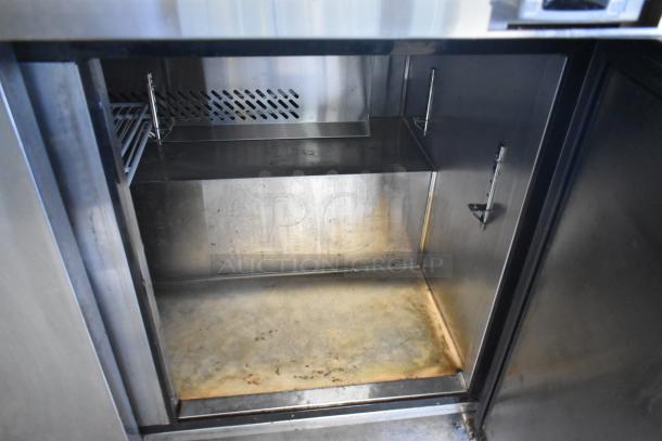 2019 Bison BST-72-30 stainless steel prep table interior, showing storage space and shelving. 115 volts, 1 phase. Used condition.