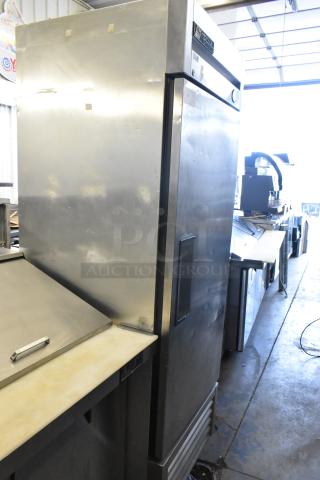 True T-23 stainless steel commercial single door reach-in cooler on casters, features poly coated racks; 115V, 1 phase.