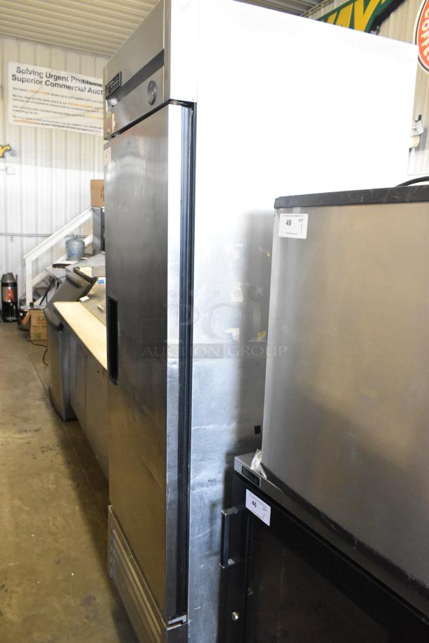 True T-23 stainless steel commercial single door cooler with poly-coated racks, on casters. Model T-23, 115V, 1 phase.