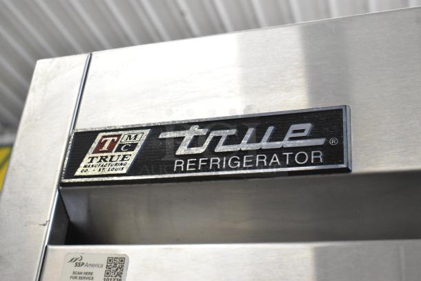 True T-23 Stainless Steel Commercial Reach-In Cooler, single door, poly coated racks, True logo visible, good condition.