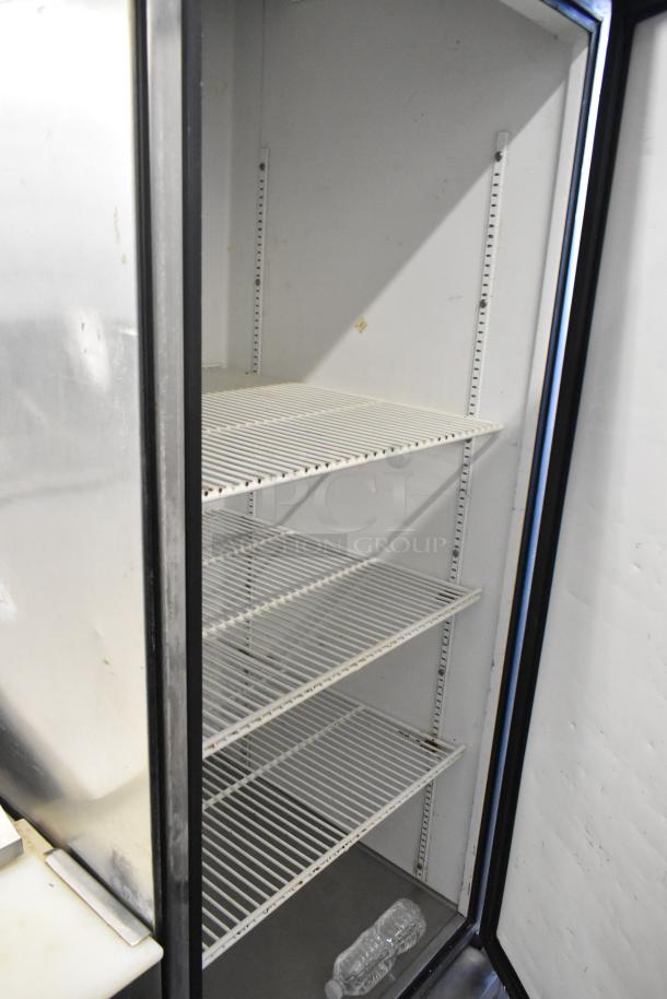 True T-23 stainless steel reach-in cooler, single door, poly-coated racks, on commercial casters, 115 volts, 1 phase.