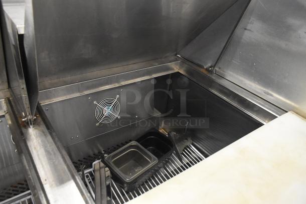 2019 Bison BST-72-30 stainless steel sandwich salad prep table, mega top, visible interior, fan, and pans on commercial casters.