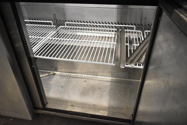2019 Bison BST-72-30 stainless steel commercial prep table interior, shelves visible, on commercial casters.