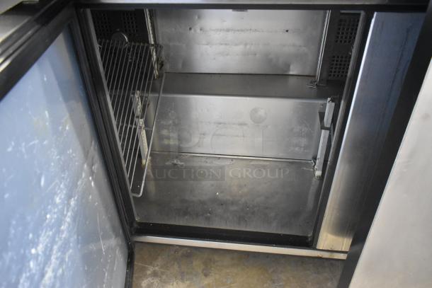 2018 True TSSU-72-30MB-ST-HC stainless steel commercial prep table interior, shelves, visible wear, on casters, 115V.