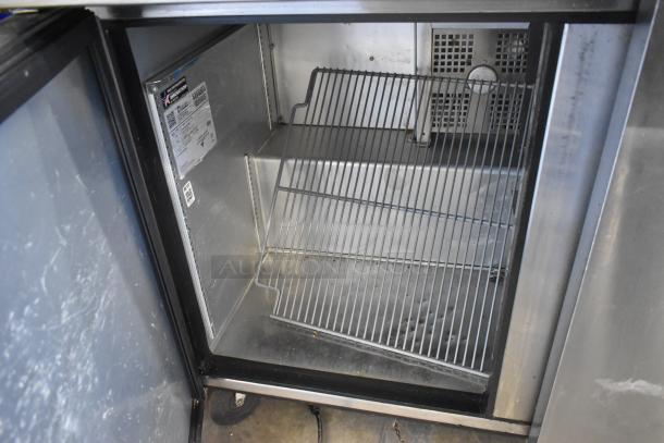 2018 True TSSU-72-30MB-ST-HC stainless steel prep table interior view; shelves, commercial casters, and model label visible.