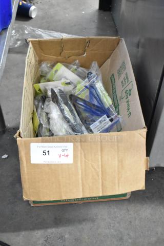 Box of brand new kitchen items, including tongs, still in packaging. Auction lot number 51 visible on label.
