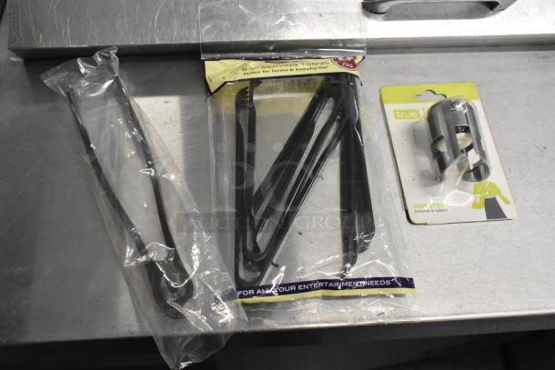 Lot of brand new items featuring serving tongs in packaging and a chrome wine stopper by True Fit. Ideal for parties.