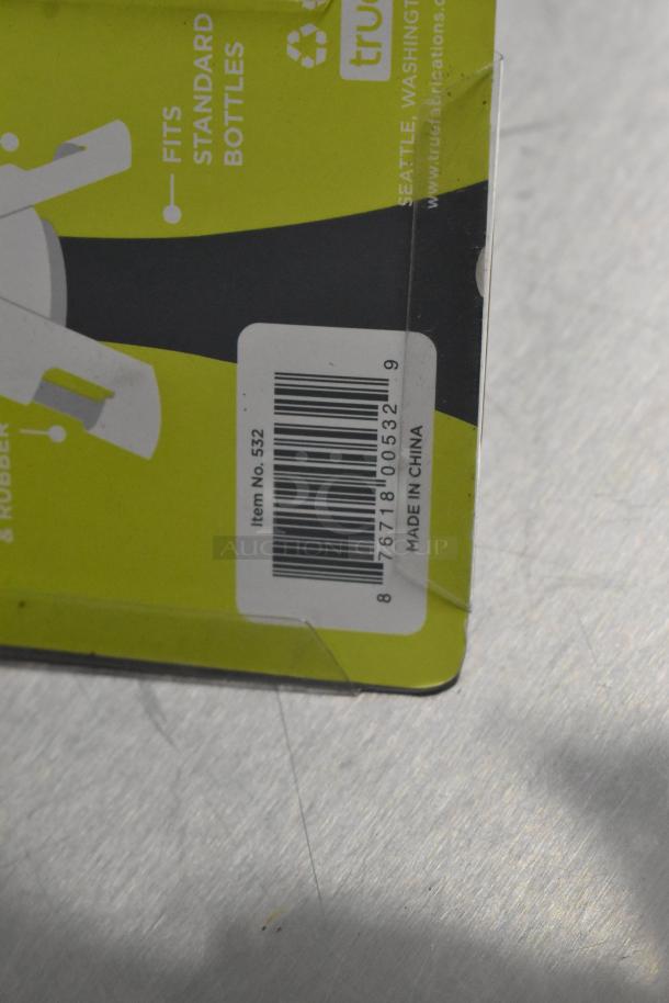 Alt text: Lot of brand new items including tongs, with packaging labels showing item no. 532, barcode, and "Made in China."