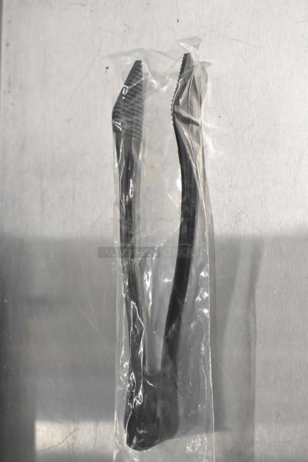 Brand new black tongs in sealed plastic packaging. Part of a mixed lot auction item.