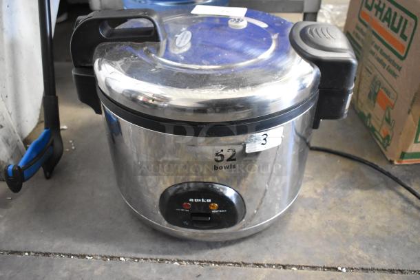Amko AK-50RC stainless steel countertop rice cooker, 120V, used condition, visible labels, capacity marked as 52 bowls.