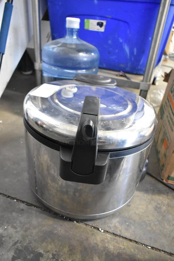Amko AK-50RC stainless steel countertop rice cooker, 120 volts, 1 phase, with black handle, in used condition.