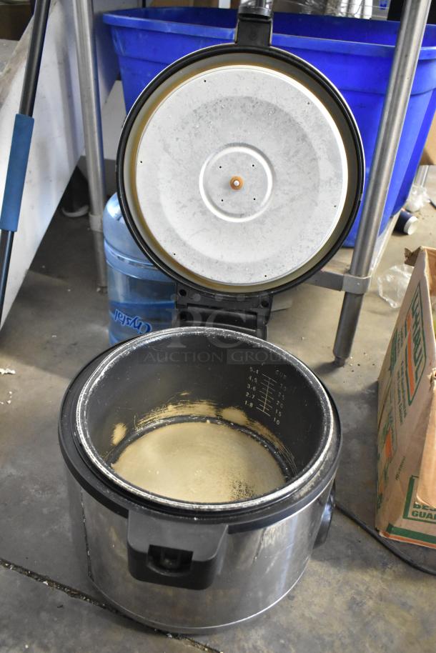 Amko AK-50RC stainless steel countertop rice cooker, showing interior with measuring marks, used condition, 120V, 1 phase.