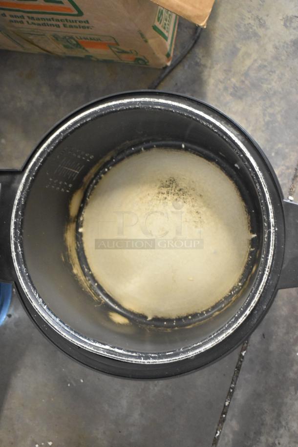 Amko AK-50RC stainless steel rice cooker, used condition, interior view with residue, 120 volts, 1 phase.