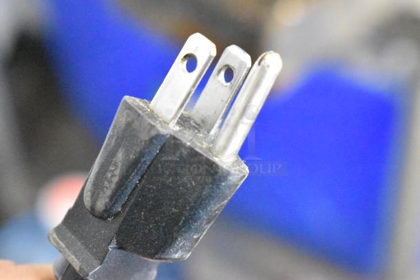 Close-up of a standard three-prong power plug from an Amko AK-50RC Stainless Steel Countertop Rice Cooker.